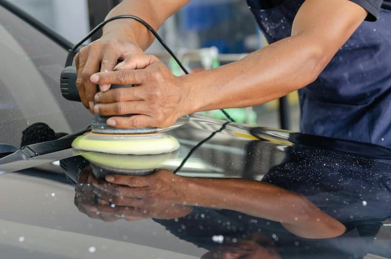 Car being professionally detailed — clean shine on exterior