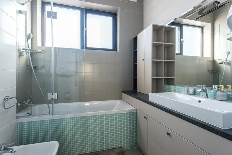 Renovated rental unit kitchen with new cabinets and countertops